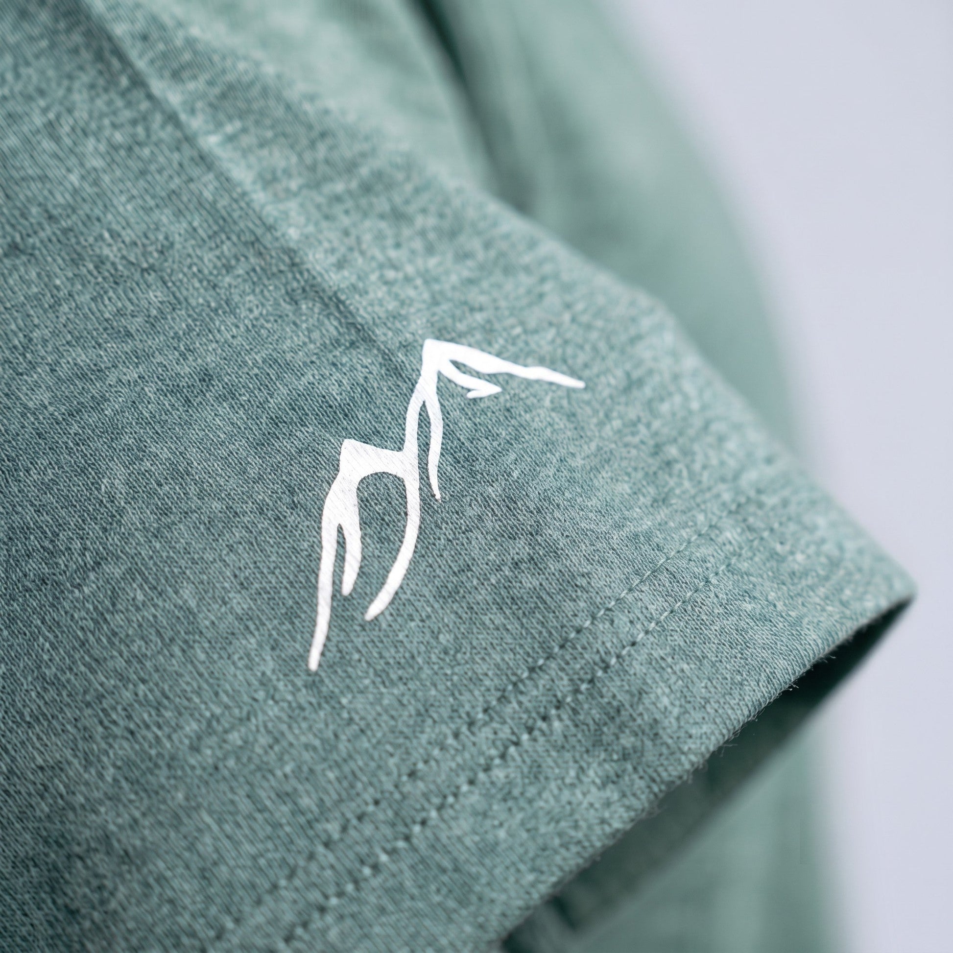 Off Piste Athletic Tee – Unisex All-Season T-Shirt in Seafoam, detail view — Off Piste Alpine Tech collection