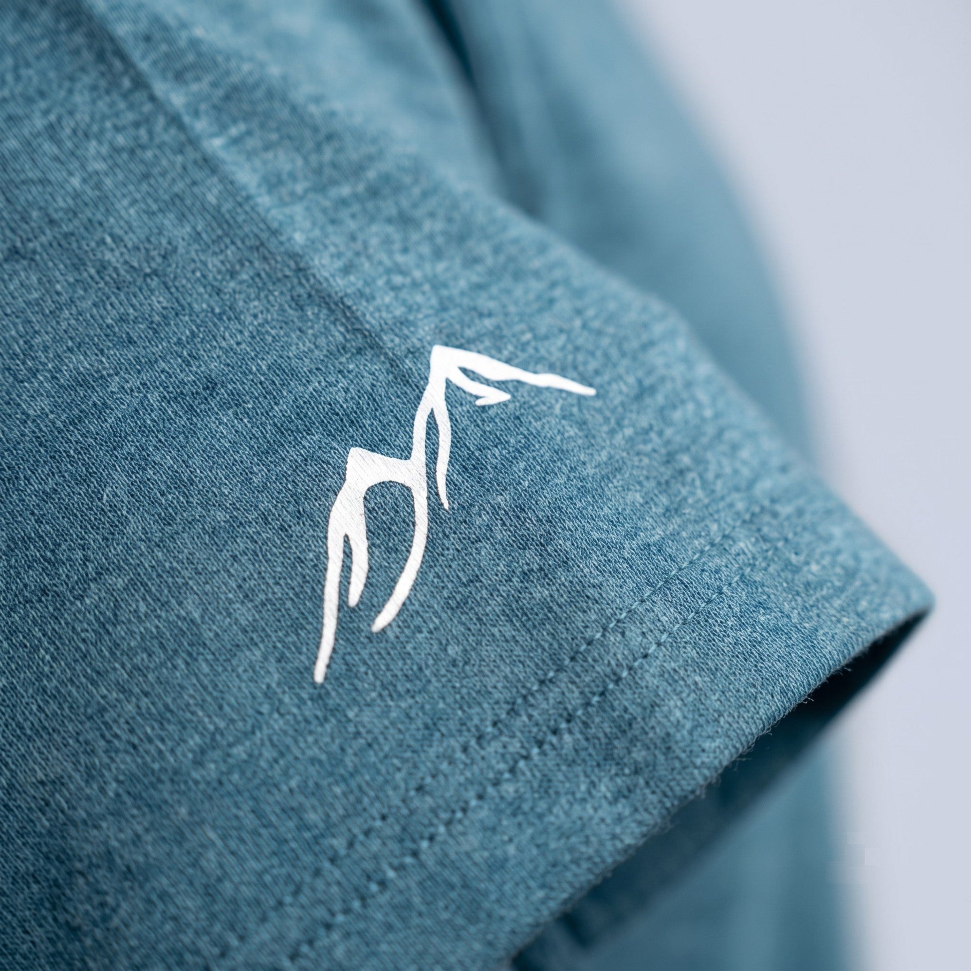 Off Piste Athletic Tee – Unisex All-Season T-Shirt in Teal, detail view — Off Piste Alpine Tech collection
