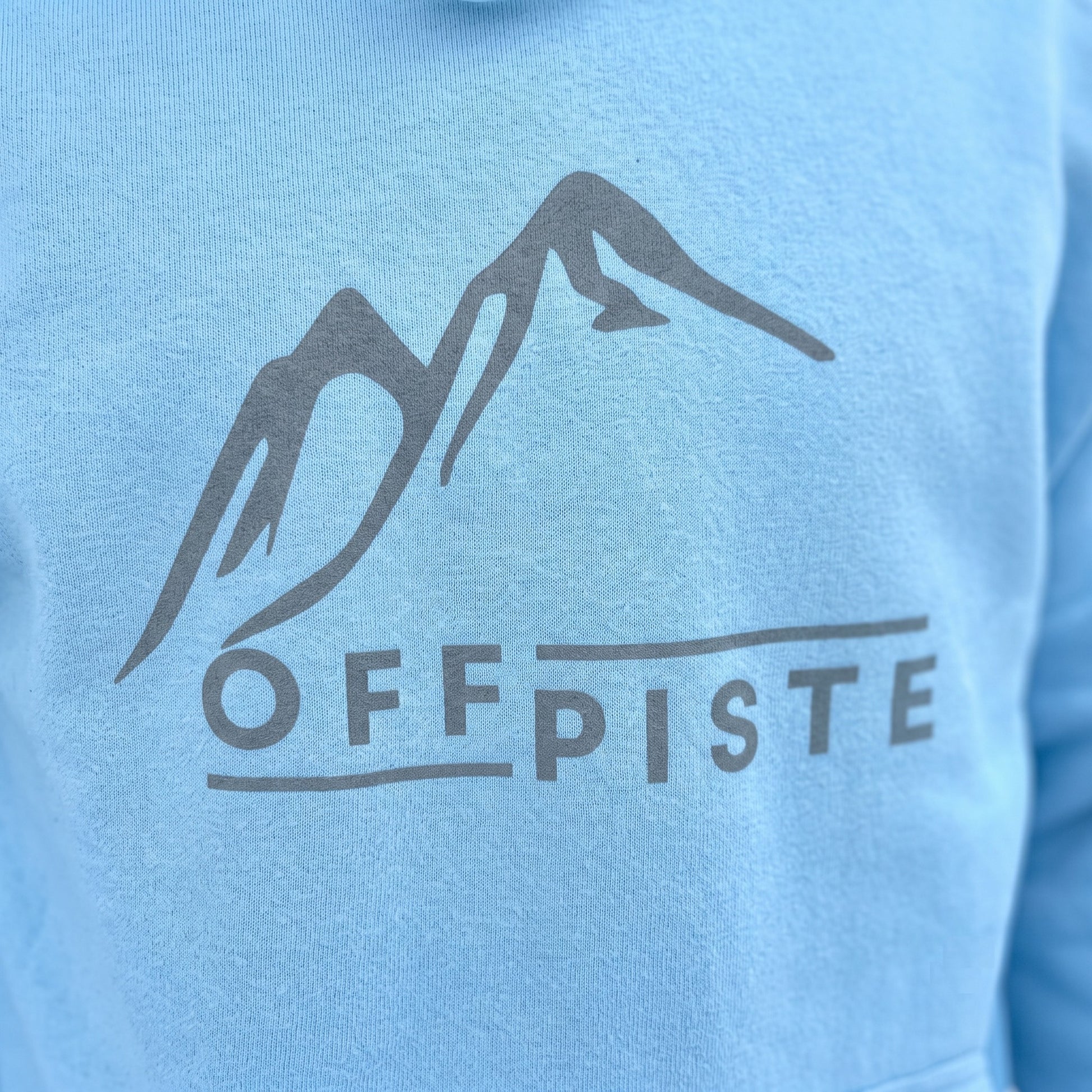 Off Piste Logo Ski Hoodie in Ice, detail view — Off Piste Alpine Tech collection
