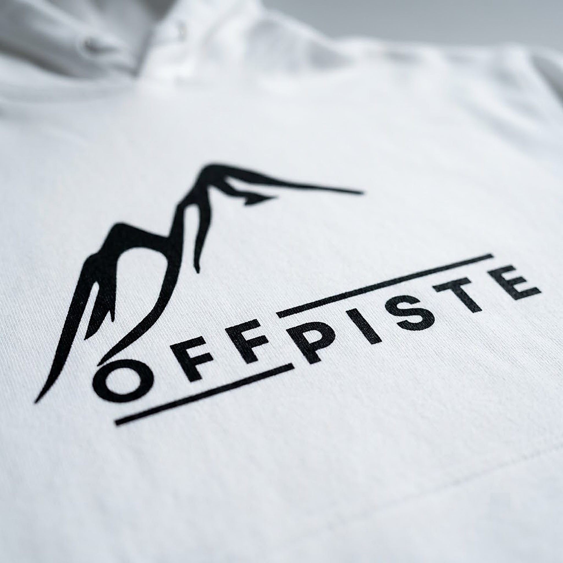 Off Piste Logo Ski Hoodie in White, detail view — Off Piste Alpine Tech collection